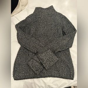 Cable knit sweater with cuffed sleeves. Perfect cozy but cool sweater.